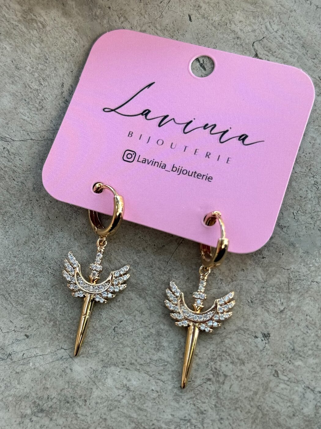 Winged dagger earrings